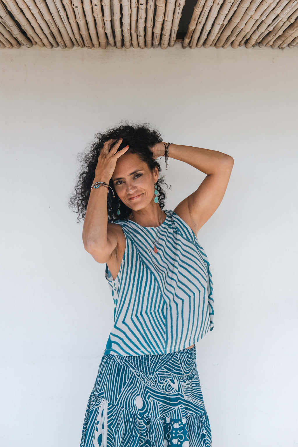 Model wearing the LeMerch Flowy Skirt and Flowy Top, featuring an original artistic print.