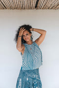 Model wearing the LeMerch Flowy Skirt and Flowy Top, featuring an original artistic print.