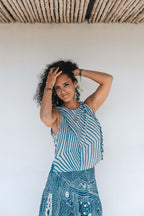 Model wearing the LeMerch Flowy Skirt and Flowy Top, featuring an original artistic print.