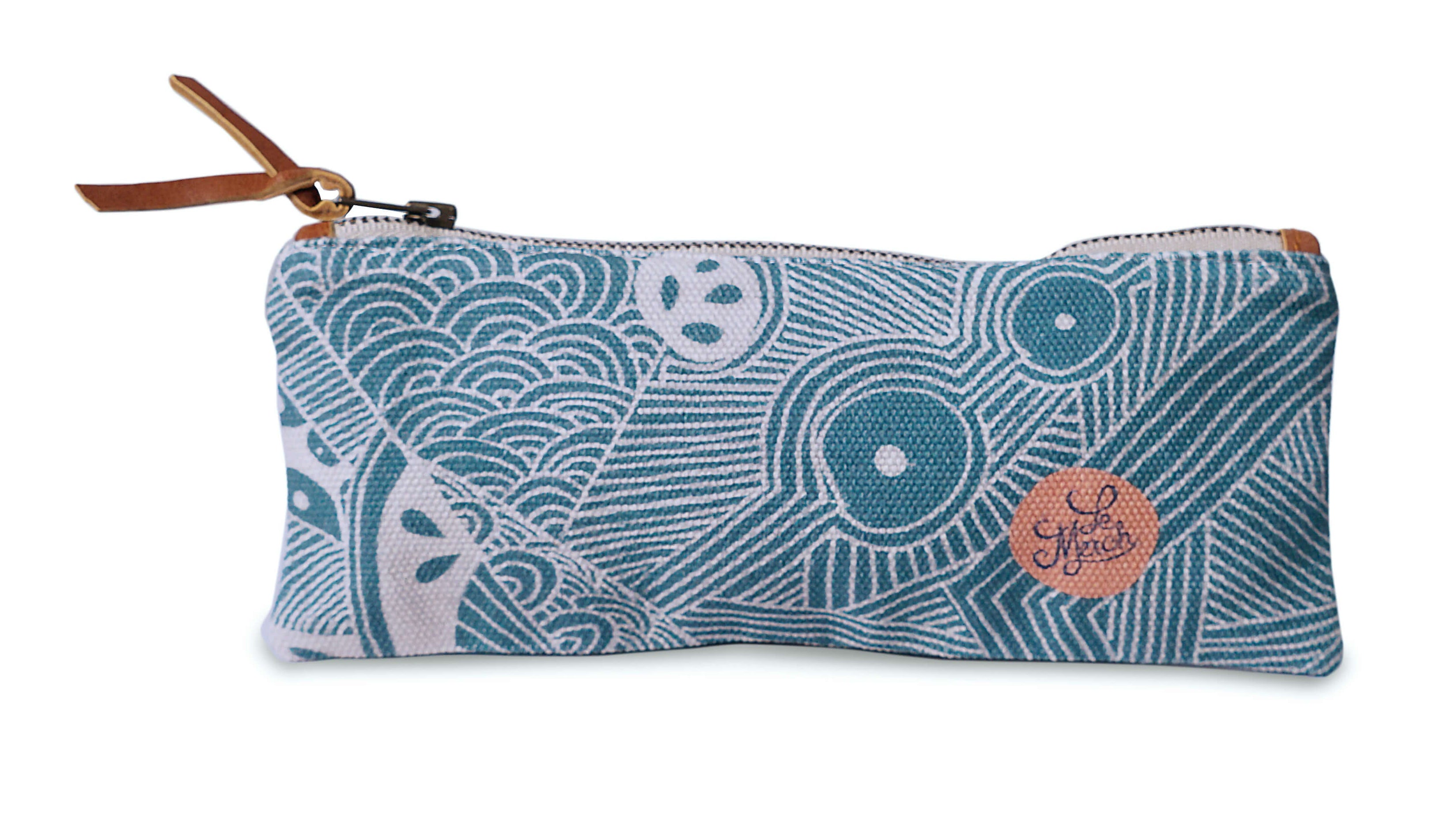 Pencil case. Blue patterned pouch with a brown zipper on a white background
