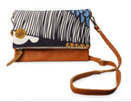 Floral-patterned handbag with brown strap on a white background