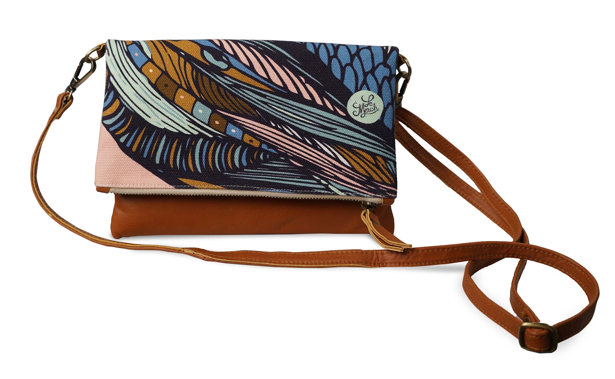 Multicolored patterned handbag with brown strap on a white background