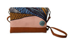 Multicolored clutch bag with a wrist strap on a white background
