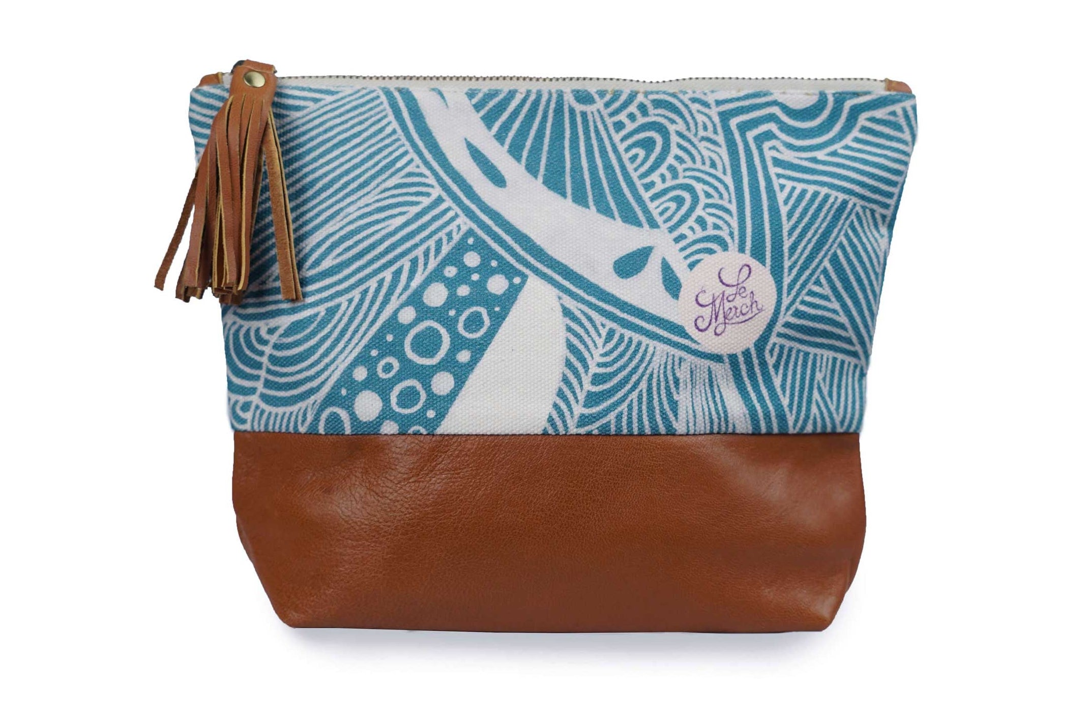Pouch with blue patterned top and brown leather bottom on a white background