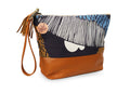Multicolored clutch bag with a tassel on a white background
