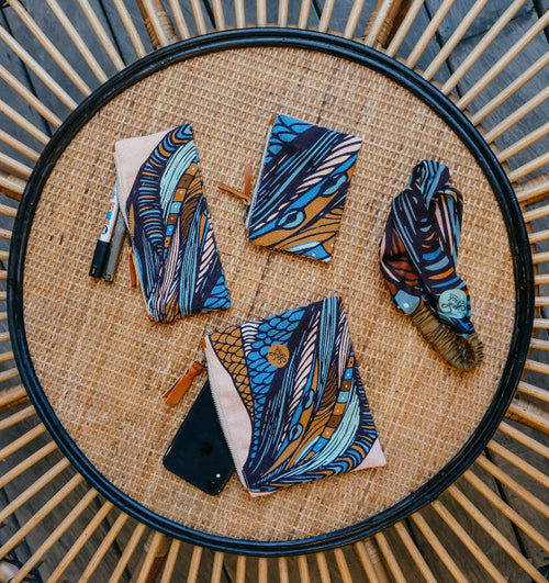 Illustrated fabric for small pouches with a blue and brown pattern on rattan